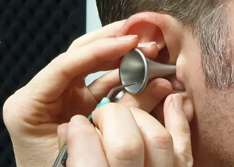 Ear wax removal via microsuction and a metal specula to protect the ear canal - HearClear